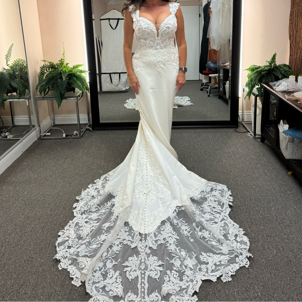 Exquisite Martina Liana ivory beaded gown is shoulder straps or strapless